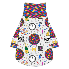 Tee shirt with turtleneck in a dog friendly pattern that shows a multi-colored New Years ball, the words Mommy's Midnight Kiss, a clock, champagne bottle and champagne toast, fireworks, confetti and more on a white background.  It's complete with NYE Ball trim on the neck, waist and sleeves.