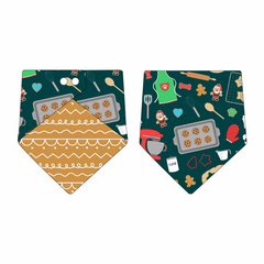 Bandana in a dog friendly pattern that shows cookies baking, a light green apron, recipe cards and more on a deep emerald background. Design is reversible with gingerbread on the opposite side.