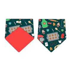 Bandana in a dog friendly pattern that shows cookies baking, a light green apron, recipe cards and more on a deep emerald background. Design is reversible with red on the opposite side.