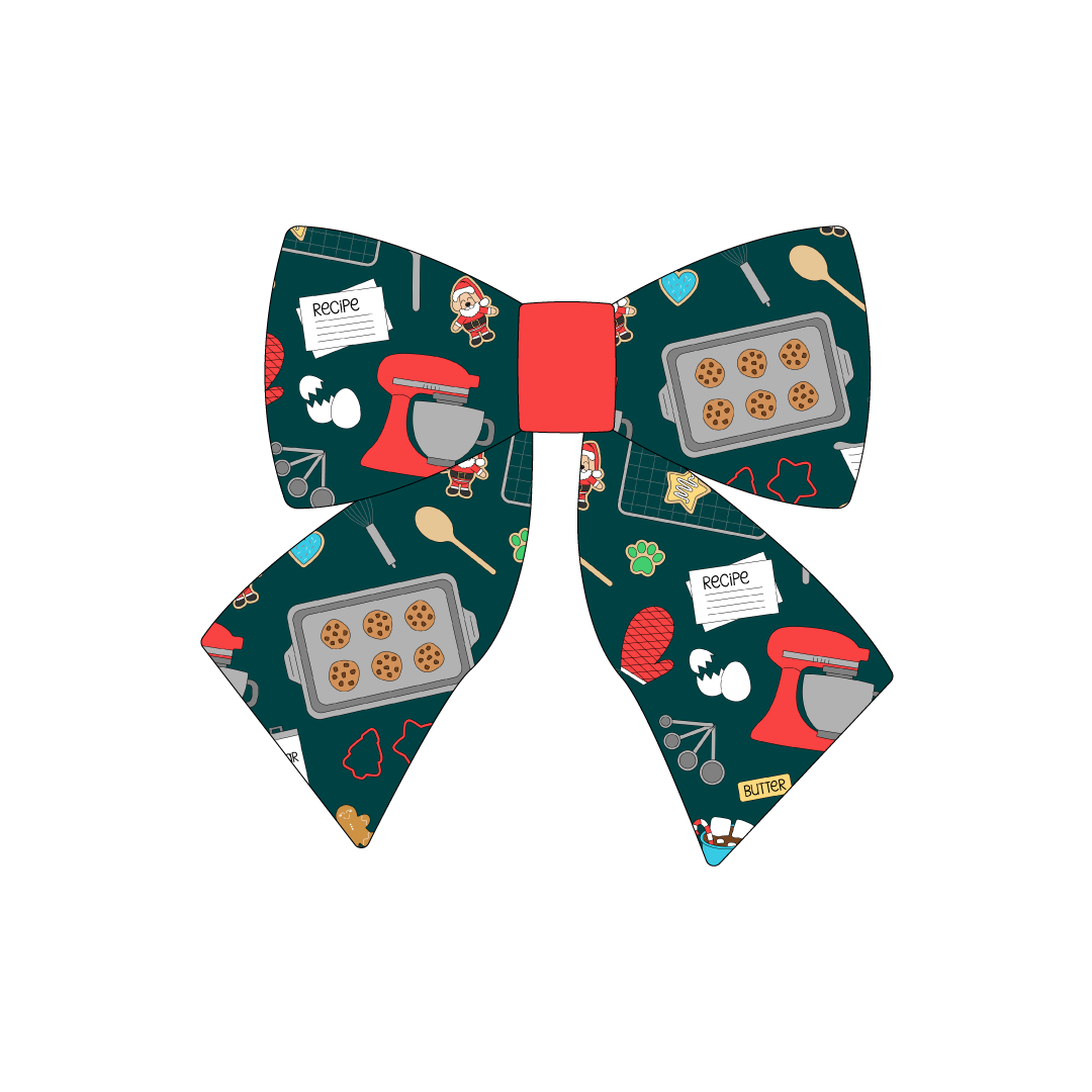 Sailor bow in a dog friendly pattern that shows cookies baking, a light green apron, recipe cards and more on a deep emerald background. Red accent in the center of the sailor bow.  It's complete with attached elastic loops on the back to secure on dog collar.