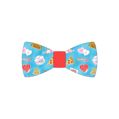 Bowtie in a dog friendly pattern that shows witty anti-Valentine phrases and fun images. The center is made from solid red trim. It's complete with attached elastic loops on the back to secure on dog collar.