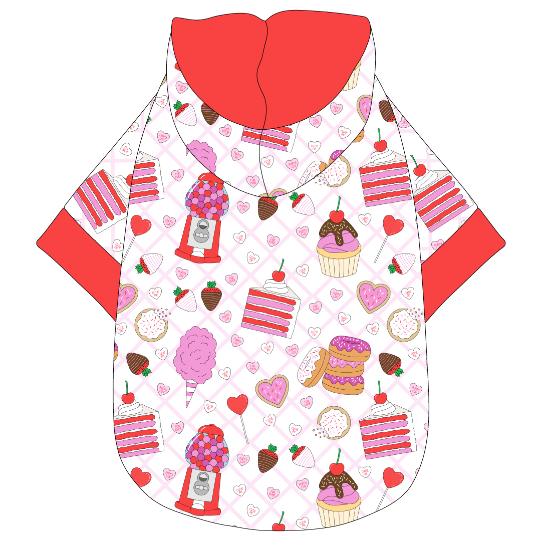 Hoodie in a dog friendly pattern that shows a variety of sweet treats. It's complete with a hood lined in solid red trim, which is also found on the sleeve edges and waist.