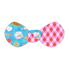 Hair bow twisted with two fabrics: one side in Valentine Schmalentine and one side in Valentine Argyle Plaid.