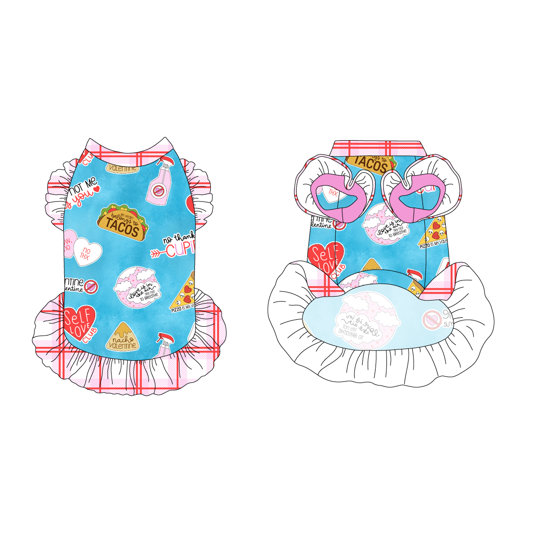 Dress with ruffle accents on the shoulders and girly ruffle skirt in a dog friendly pattern that shows witty anti-Valentine phrases and fun images. It's complete with red and pink plaid trim on the neck and ruffles, as well as a coordinating trim under the shoulder ruffles in solid pink.