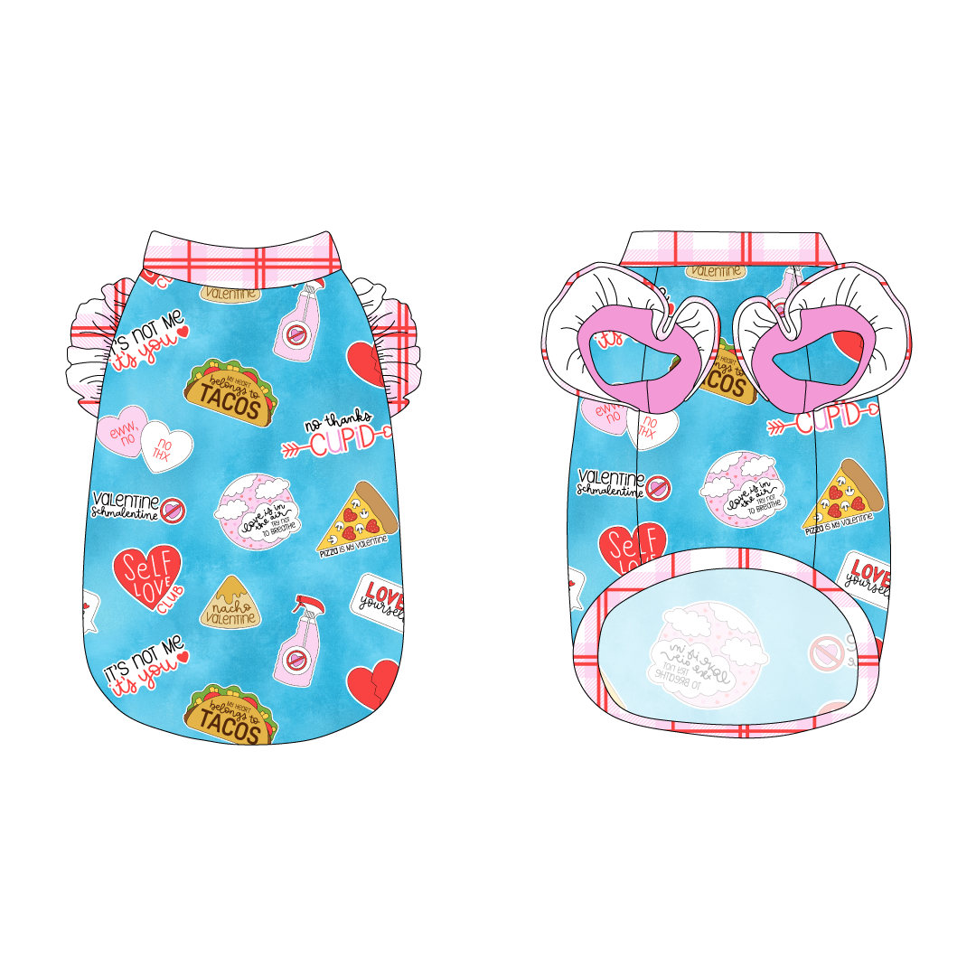 Tank with ruffle accents on the shoulders in a dog friendly pattern that shows witty anti-Valentine phrases and fun images. It's complete with red and pink plaid trim on the neck, waist and shoulder ruffles, as well as a coordinating trim under the shoulder ruffles in solid pink.