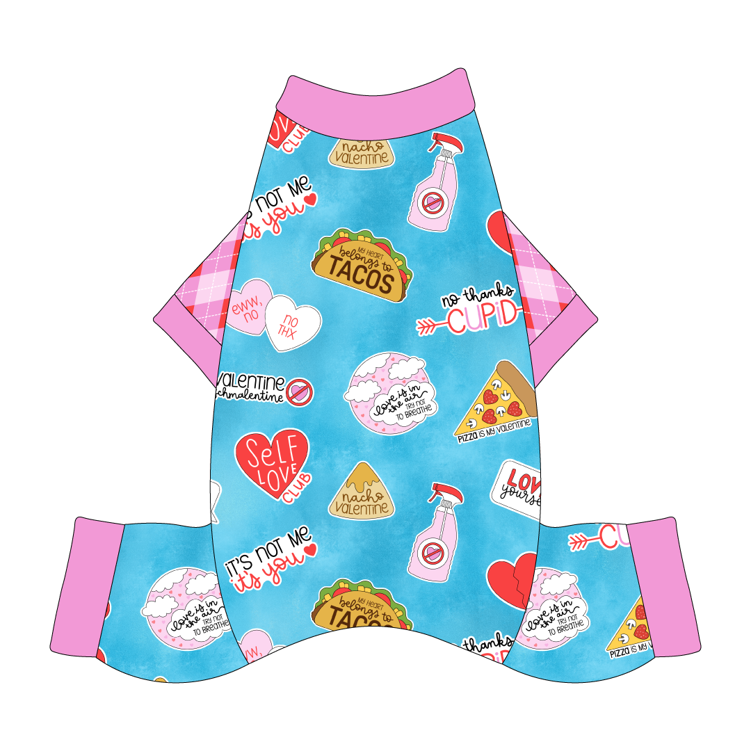 Comfy Pajamas with Valentine argyle plaid sleeves and a dog friendly pattern that shows witty anti-Valentine phrases and fun images. It's complete with solid pink trim on the neck, sleeves and legs.