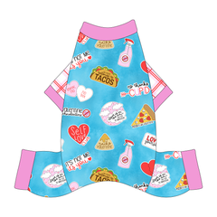 Comfy Pajamas with red and pink plaid sleeves and a dog friendly pattern that shows witty anti-Valentine phrases and fun images. It's complete with solid pink trim on the neck, sleeves and legs.