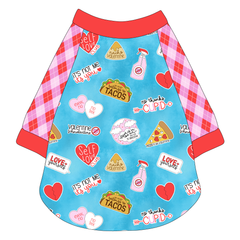 Raglan style tee in a dog friendly pattern that shows witty anti-Valentine phrases and fun images. It's complete with Valentine argyle plaid sleeves, with solid red trim on the sleeve edges, neck and waist.