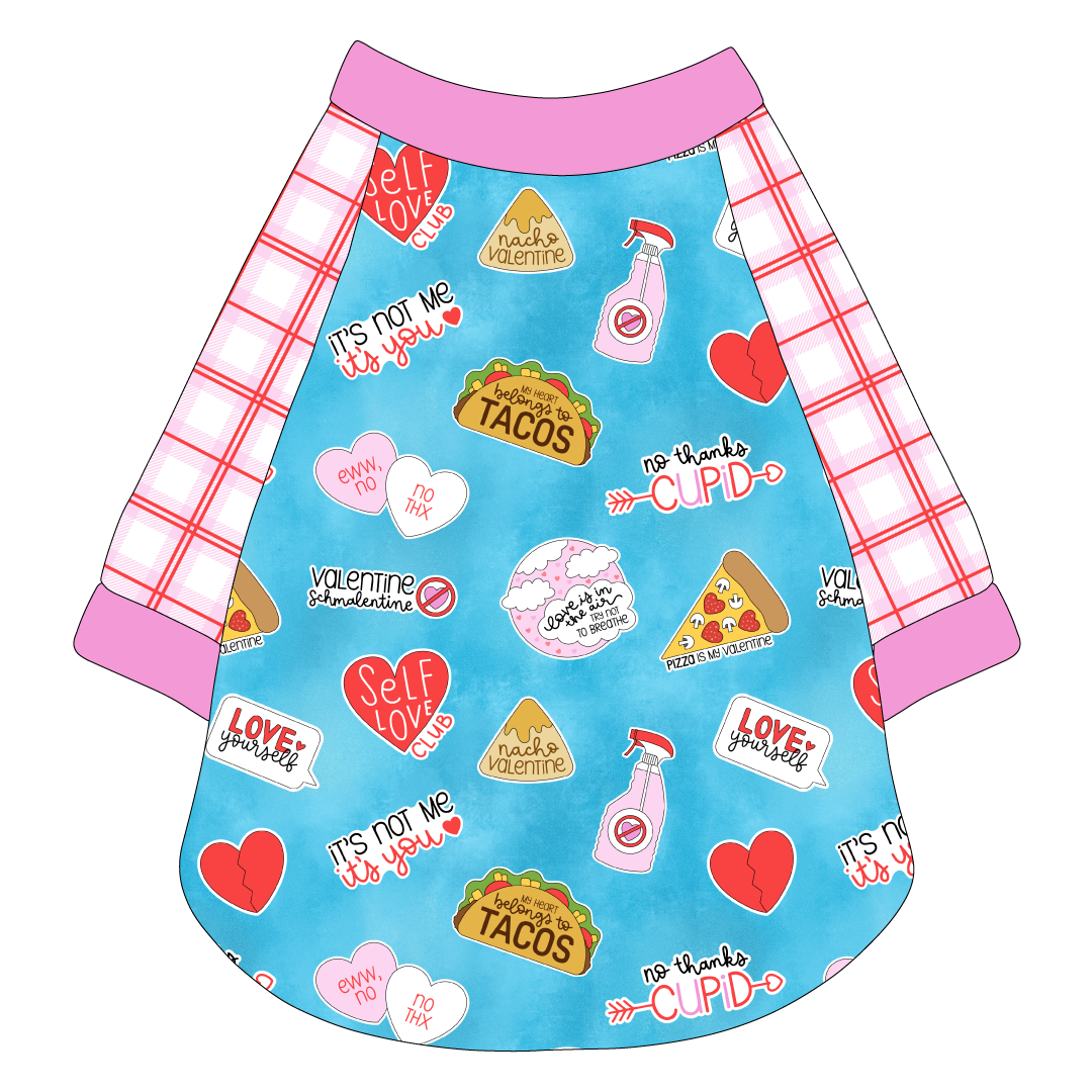 Raglan style tee in a dog friendly pattern that shows witty anti-Valentine phrases and fun images. It's complete with red and pink plaid sleeves, with solid pink trim on the sleeve edges, neck and waist.
