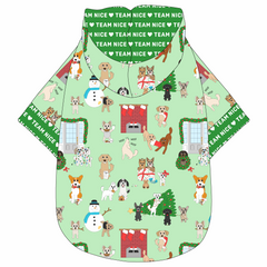 Hoodie in a dog friendly pattern that shows the different dog breeds being naughty at Christmas.  Some are getting in gifts, some knocked over the tree, some are tangled in lights, and more. Design is on a light green background. It's complete with a hood lined in green that reads Team Nice in white. Green Team Nice trim is on the waist and sleeves.