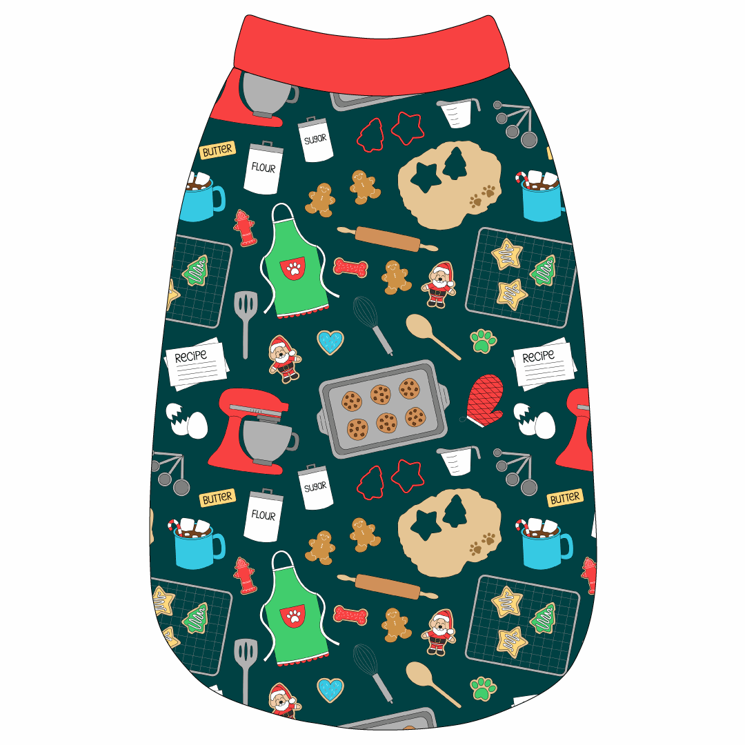 Tank in a dog friendly pattern that shows cookies baking, a light green apron, recipe cards and more on a deep emerald background. It's complete with red trim on the neck, waist and shoulders.