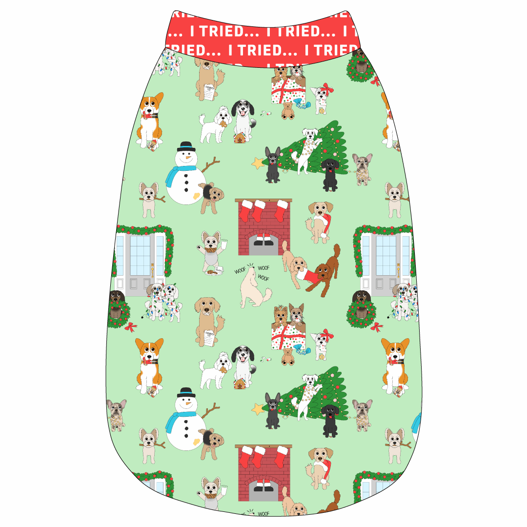 Tank in a dog friendly pattern that shows the different dog breeds being naughty at Christmas.  Some are getting in gifts, some knocked over the tree, some are tangled in lights, and more. Design is on a light green background. It's complete with red trim that reads I Tried in white on the neck, waist and shoulders.