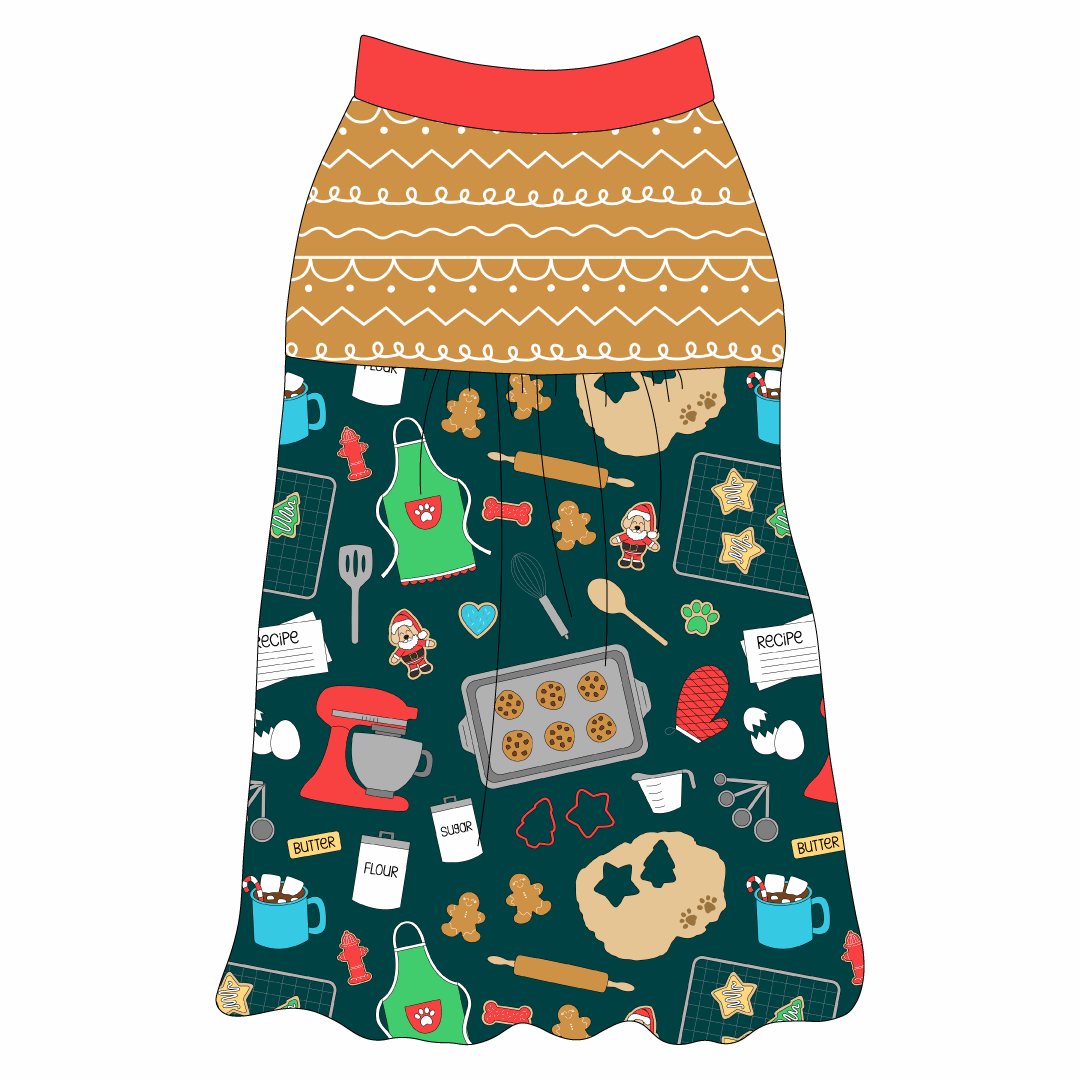 Tank style in a dog friendly pattern that shows cookies baking, a light green apron, recipe cards and more on a deep emerald background. It's complete with gingerbread on the upper back and gathering at the yoke. Red trim is on the neck and shoulders.