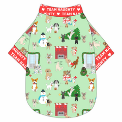 Tee shirt in a dog friendly pattern that shows the different dog breeds being naughty at Christmas.  Some are getting in gifts, some knocked over the tree, some are tangled in lights, and more. Design is on a light green background. It's complete with red trim that reads Team Naughty in white on the neck, waist and sleeves.