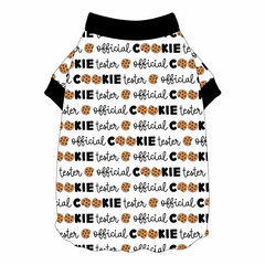 Tee shirt style with flutter hem in a dog friendly pattern that shows the text Official Cookie Tester, using two cookies for letter “o” in cookies, on a white background. Neck and sleeve trim in black.