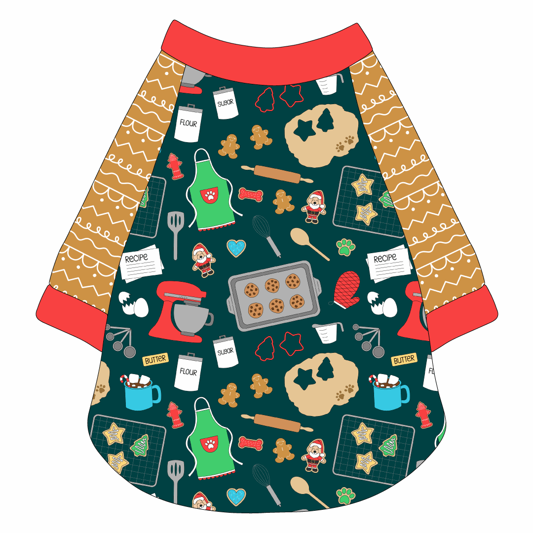 Raglan style tee in a dog friendly pattern that shows cookies baking, a light green apron, recipe cards and more on a deep emerald background. It's complete with gingerbread sleeves and trimmed in red. Red trim is also on the neck and waist.