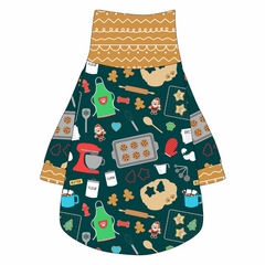 Tee shirt with turtleneck in a dog friendly pattern that shows cookies baking, a light green apron, recipe cards and more on a deep emerald background. It's complete with gingerbread trim on the neck, waist and sleeves.