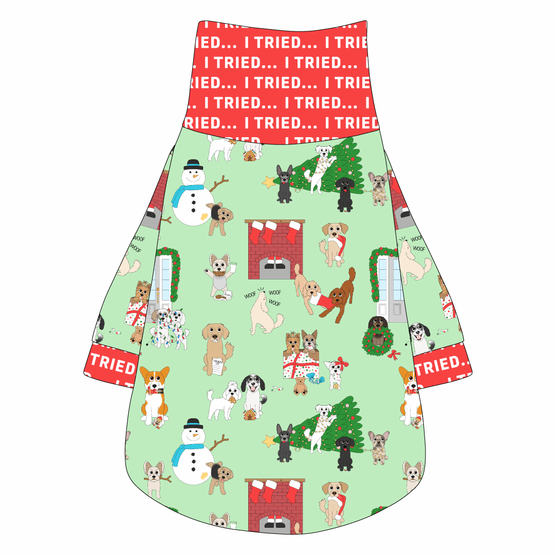 Tee shirt with turtleneck in a dog friendly pattern that shows the different dog breeds being naughty at Christmas.  Some are getting in gifts, some knocked over the tree, some are tangled in lights, and more. Design is on a light green background. It's complete with red trim that reads I Tried in white on the neck, waist and sleeves.