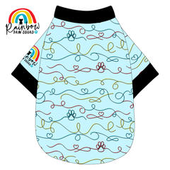 Pet shirt with colorful pattern on a light blue background, featuring the Rainbow Paw Squad logo.