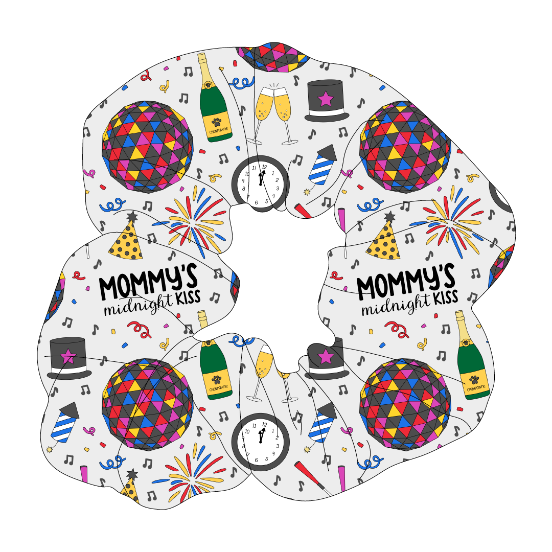 Scrunchie hair accessory in a dog friendly pattern that shows a multi-colored New Years ball, the words Mommy's Midnight Kiss, a clock, champagne bottle and champagne toast, fireworks, confetti and more on a white background.  It's complete with black trim on the neck, waist and sleeves.