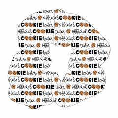 Scrunchie hair accessory in dog friendly pattern that shows the text Official Cookie Tester, using two cookies for letter “o” in cookies, on a white background.